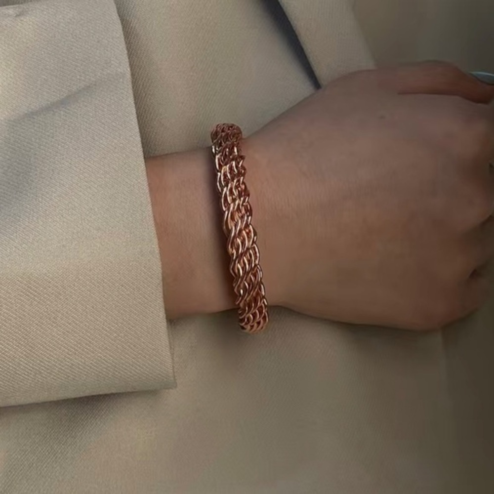 Set of three twisted bangles. Golden, silver, and rose gold. New